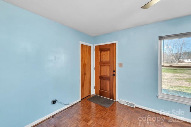 empty room featuring dark parquet floors