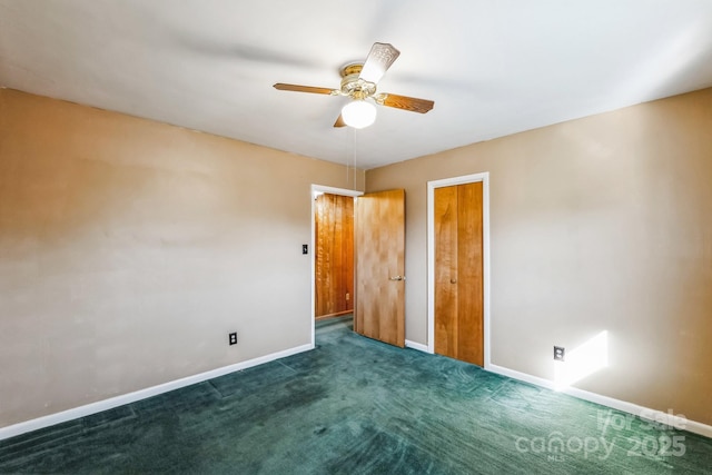 unfurnished bedroom with dark carpet and ceiling fan