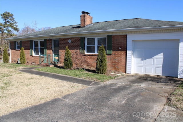 single story home featuring a garage