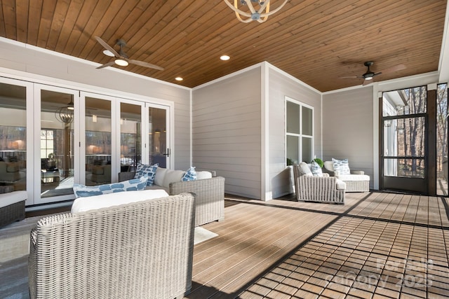 deck with outdoor lounge area and ceiling fan