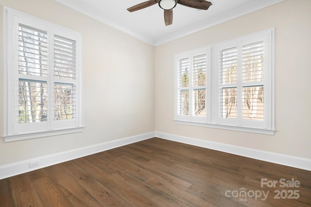 spare room featuring dark wood-type flooring, ceiling fan, and ornamental molding