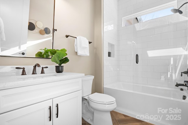 full bathroom with vanity, toilet, parquet floors, and shower / washtub combination