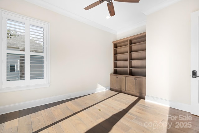 spare room with light hardwood / wood-style floors and ornamental molding