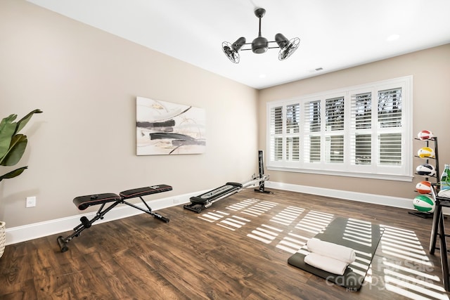 workout area with dark wood-type flooring