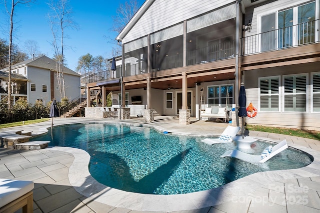 view of swimming pool featuring a patio area