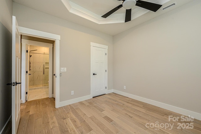 unfurnished bedroom featuring ceiling fan and light hardwood / wood-style floors