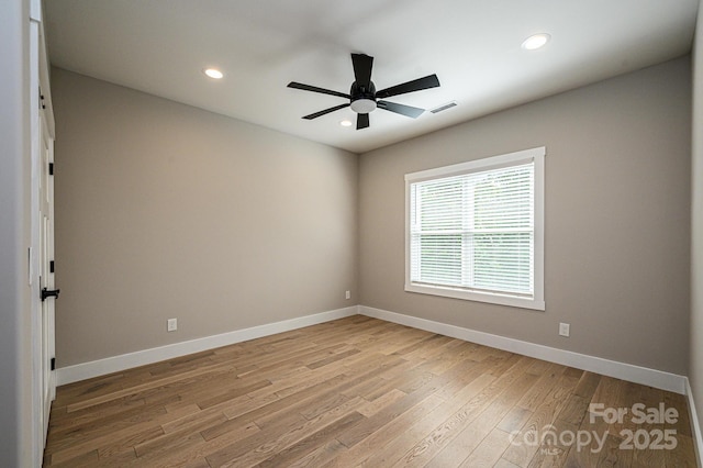 unfurnished room featuring ceiling fan and light hardwood / wood-style flooring