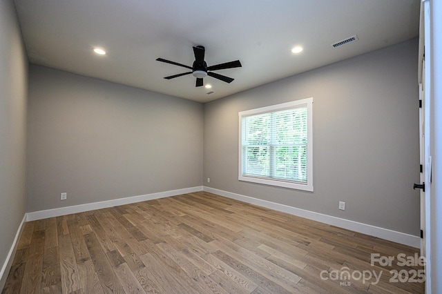 empty room with light hardwood / wood-style floors and ceiling fan