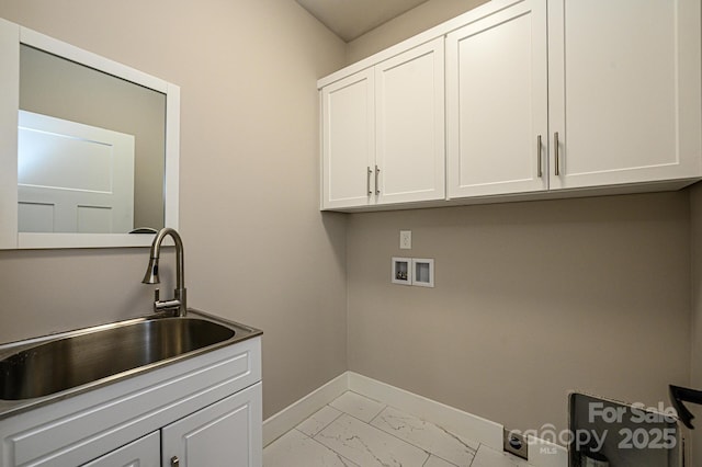 laundry room featuring washer hookup, cabinets, and sink