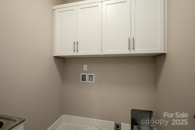 laundry room featuring hookup for an electric dryer, cabinets, and hookup for a washing machine