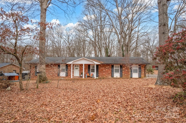 single story home featuring a porch