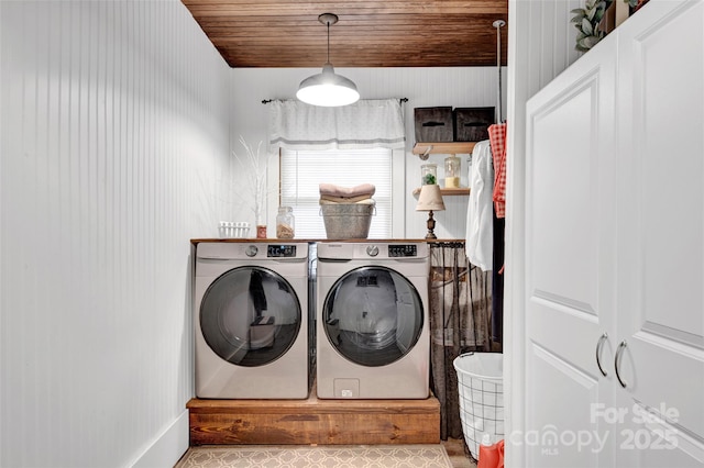 washroom with independent washer and dryer and wooden ceiling