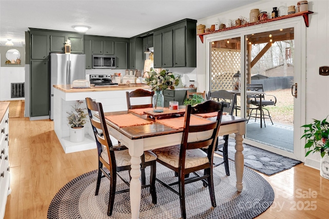 dining area with light wood-type flooring