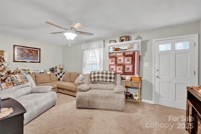 living room with ceiling fan and carpet floors