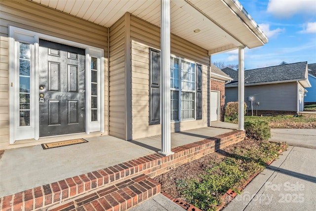 doorway to property featuring covered porch