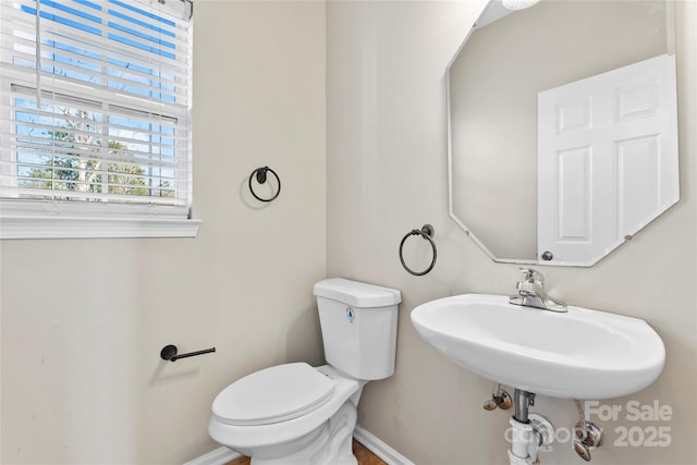 bathroom with toilet and sink