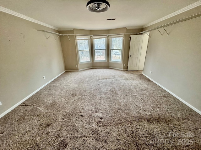 carpeted spare room featuring ornamental molding