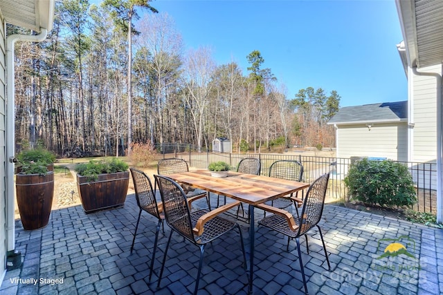 view of patio / terrace with a shed