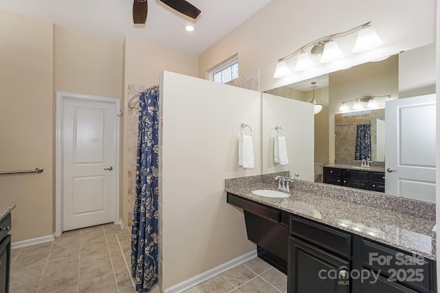 bathroom with sink, walk in shower, and ceiling fan