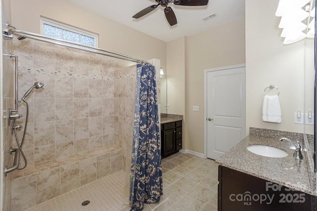 bathroom with vanity, ceiling fan, and a shower with shower curtain