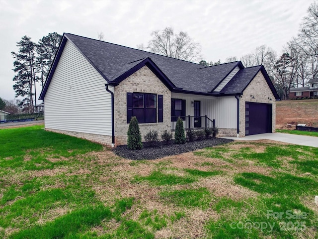 view of front facade with an attached garage, a shingled roof, concrete driveway, and brick siding