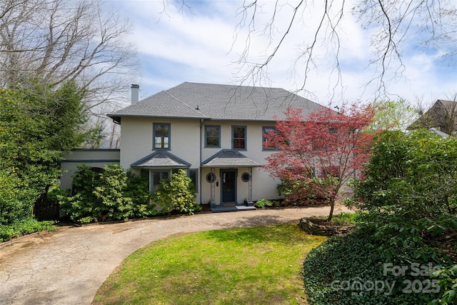 view of front of home with a front yard