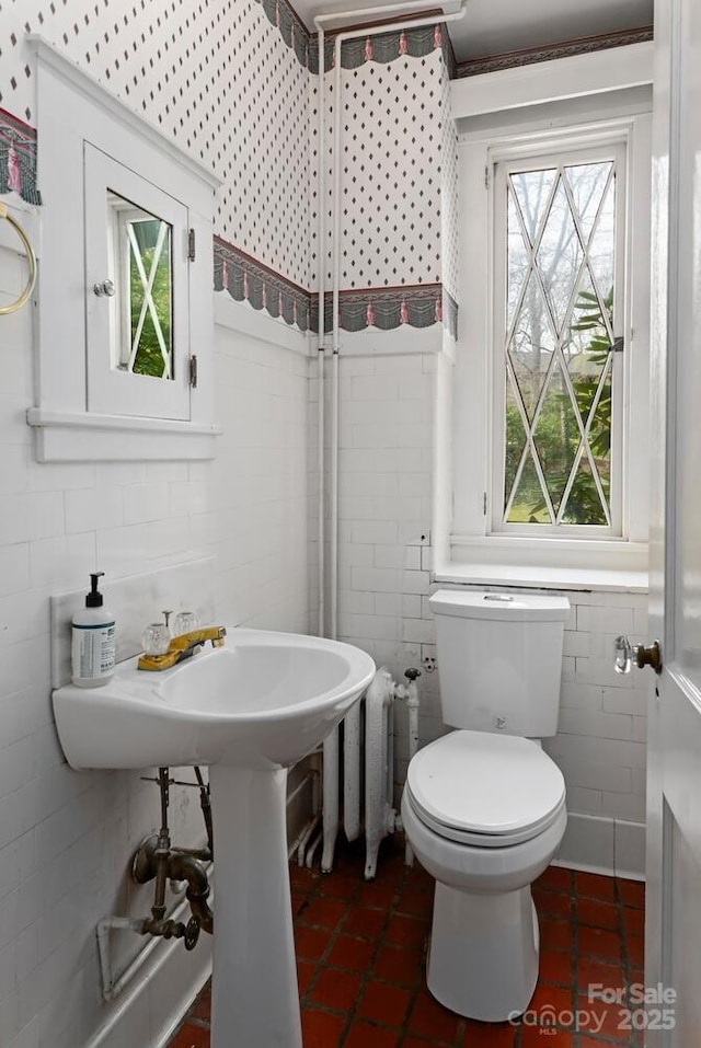 bathroom featuring tile patterned flooring and toilet