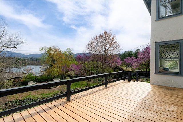 deck featuring a water and mountain view