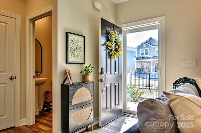 doorway to outside with hardwood / wood-style flooring