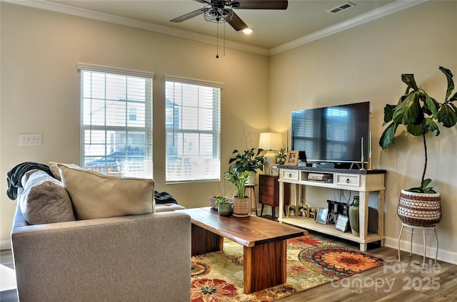 living room featuring ceiling fan, hardwood / wood-style flooring, and crown molding