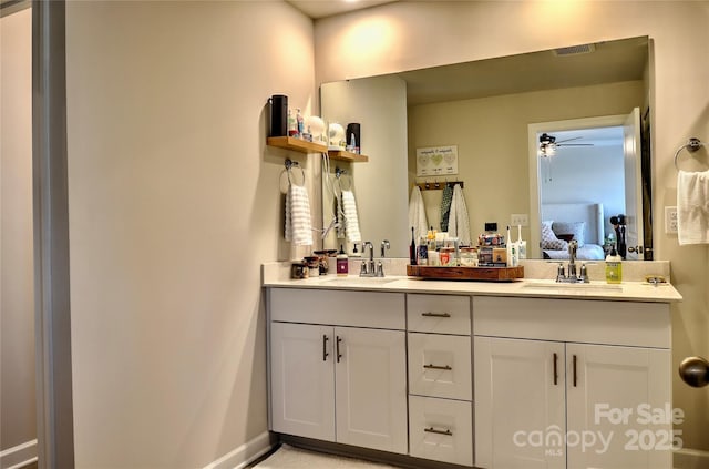 bathroom featuring ceiling fan and vanity