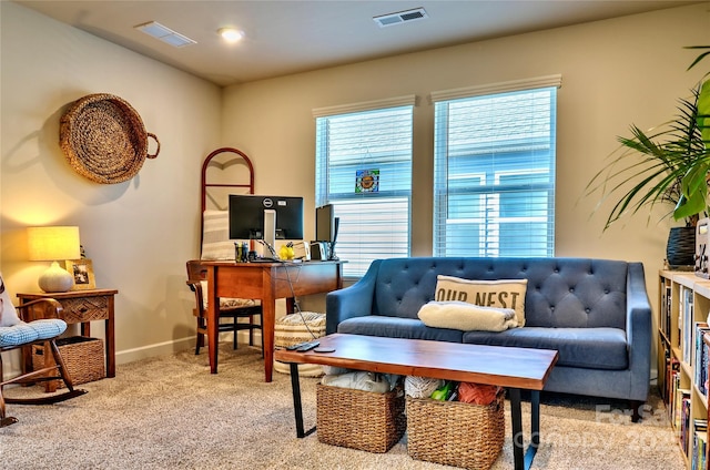 living area featuring light carpet