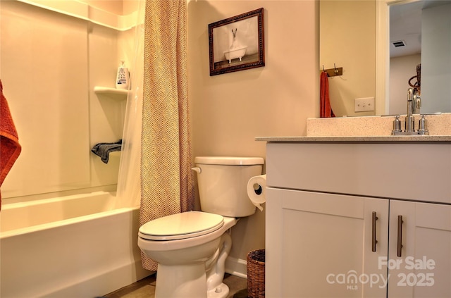 full bathroom featuring shower / tub combo, vanity, and toilet