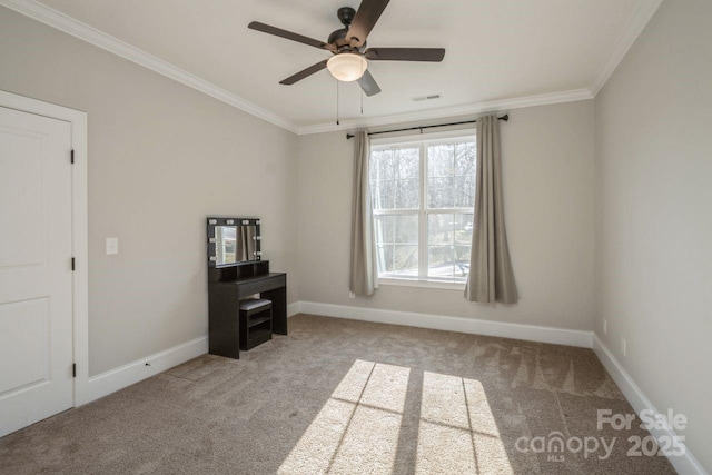 carpeted empty room featuring ceiling fan and ornamental molding