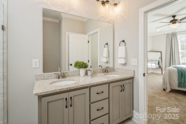 bathroom featuring ceiling fan, crown molding, and vanity