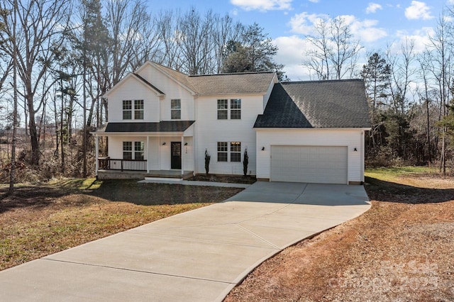 view of front of property featuring a garage and a porch