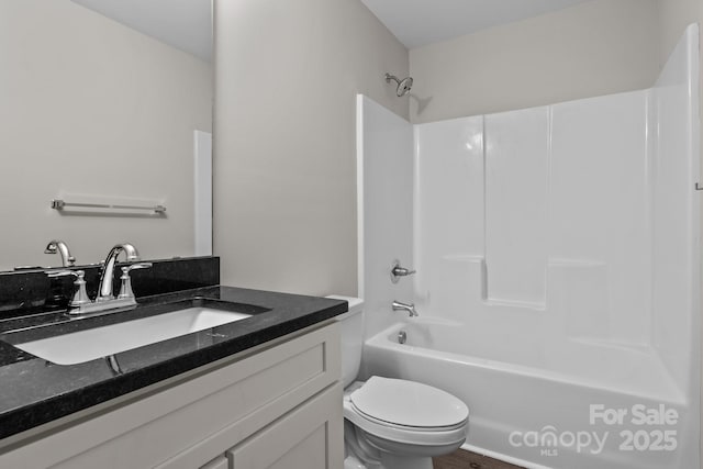 full bathroom with toilet, vanity, and shower / tub combination