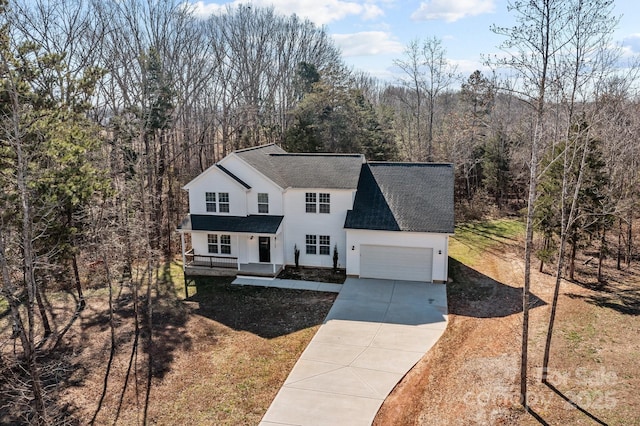 front facade featuring a garage and a porch