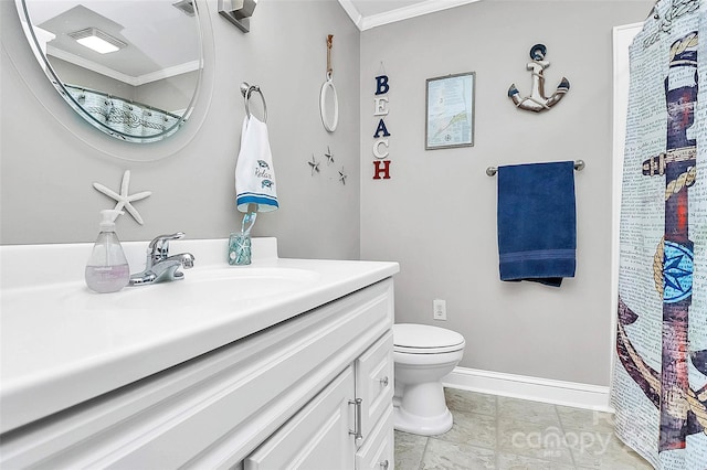 bathroom featuring vanity, ornamental molding, and toilet