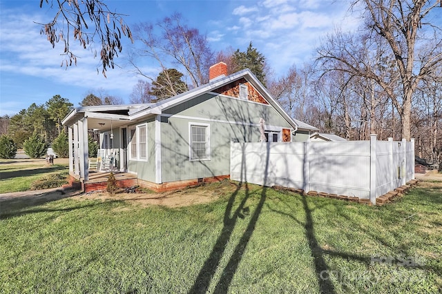 view of property exterior featuring a yard