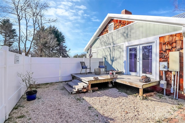 rear view of property with a wooden deck