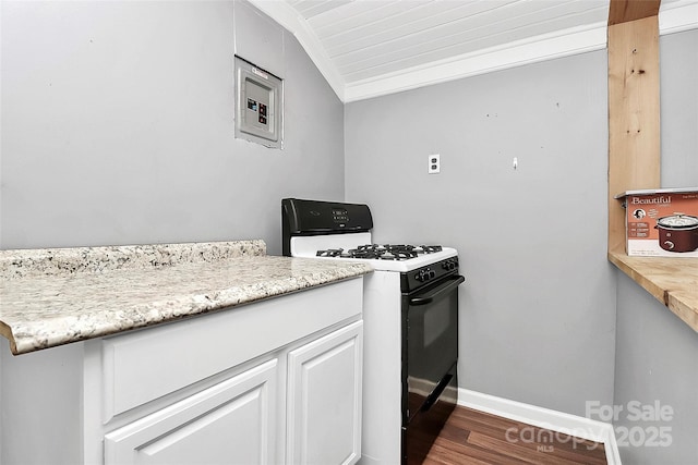 kitchen with white cabinetry, vaulted ceiling, dark hardwood / wood-style floors, electric panel, and black gas range