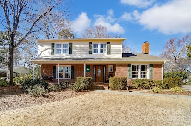 front of property featuring covered porch