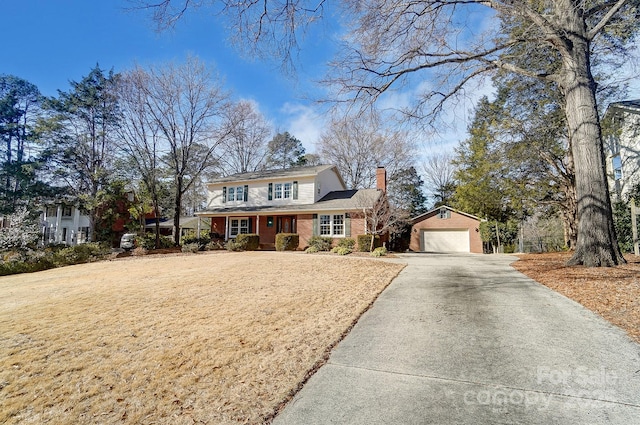 front of property with an outbuilding, a garage, and covered porch