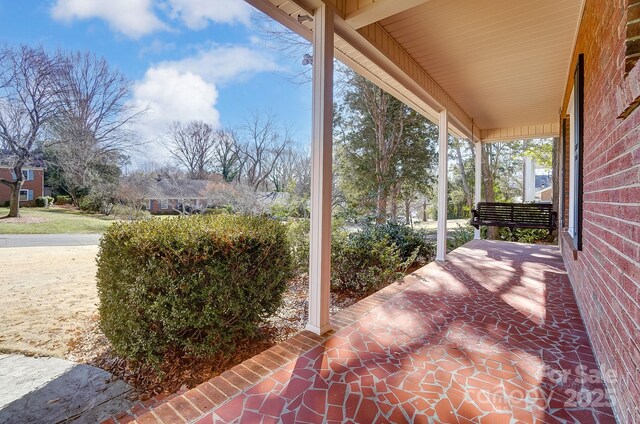 view of patio featuring a porch