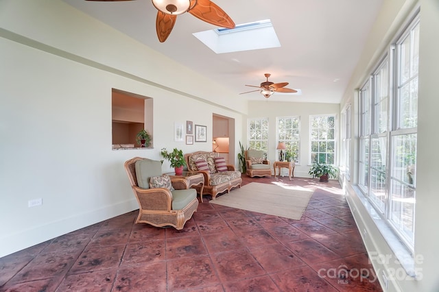 sunroom / solarium with lofted ceiling with skylight and ceiling fan