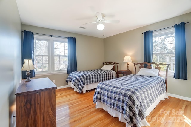 bedroom with hardwood / wood-style flooring and ceiling fan