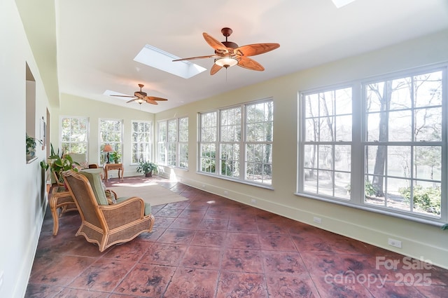 sunroom with lofted ceiling with skylight and ceiling fan