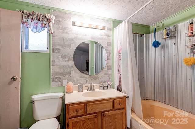 full bathroom with shower / bath combination with curtain, toilet, a textured ceiling, and vanity