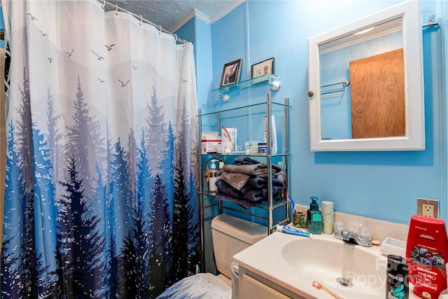 bathroom with walk in shower, vanity, a textured ceiling, crown molding, and toilet